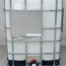 reconditioned 330 gallon tote with concrete background