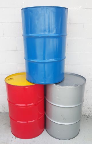 reconditioned 55 gallon drum stack of 3 colors blue red and grey with white background
