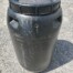 open top plastic barrel with lid grey background