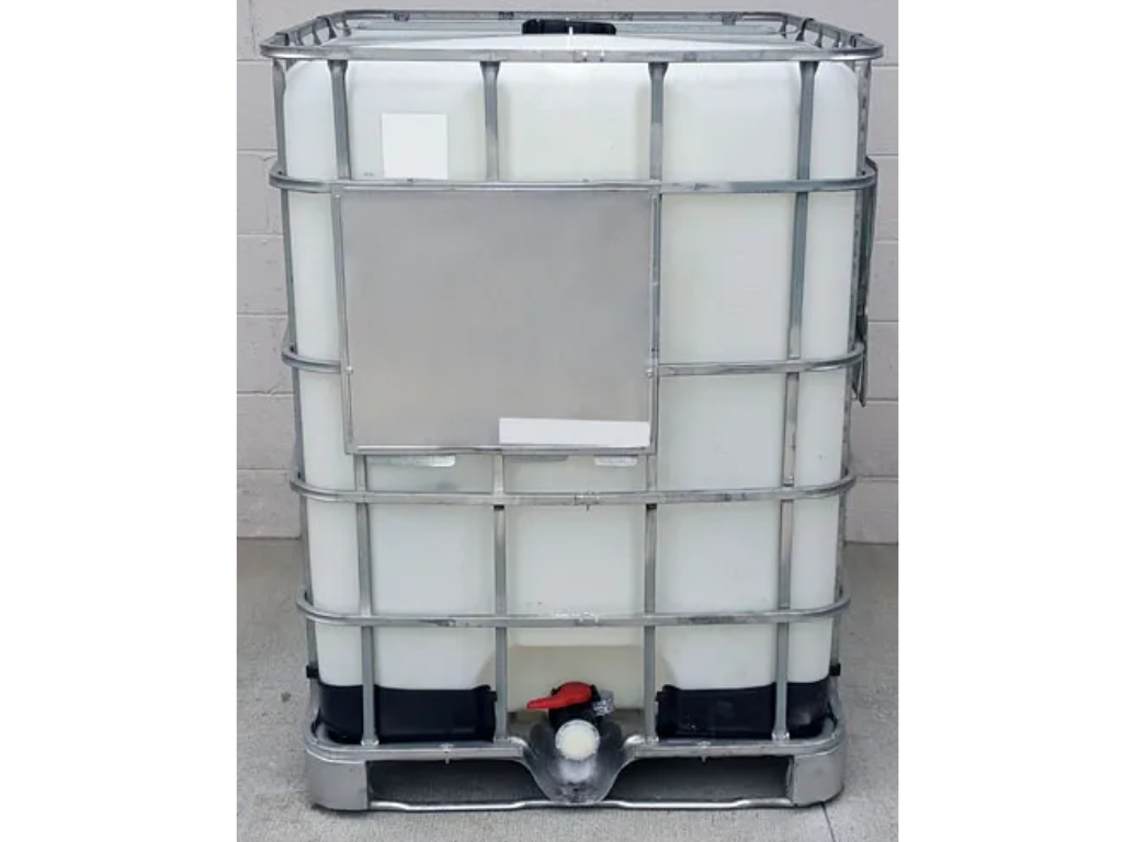 reconditioned 330 gallon tote with concrete background